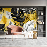 Restaurant interior featuring dramatic black and yellow Monstera leaf wall mural