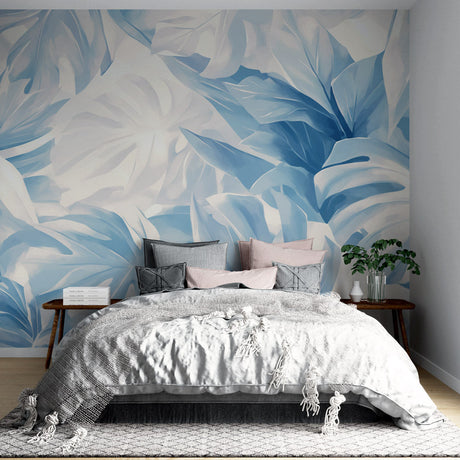 Blue Monstera leaf wallpaper creating a peaceful atmosphere in a modern living room