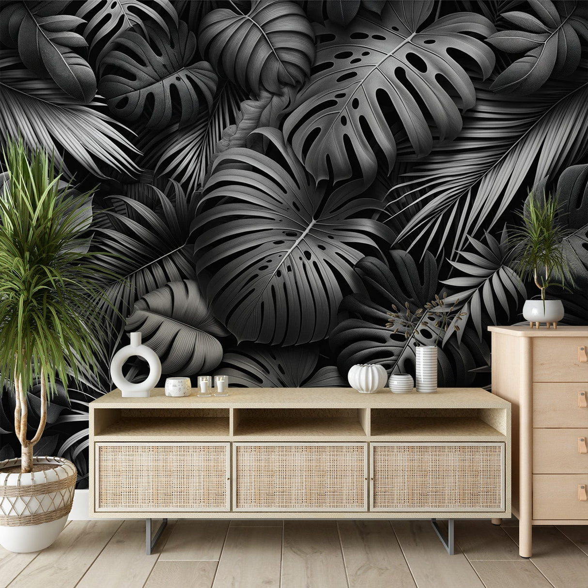 Black and white Monstera leaf wallpaper creating drama in a modern living room with minimalist furniture