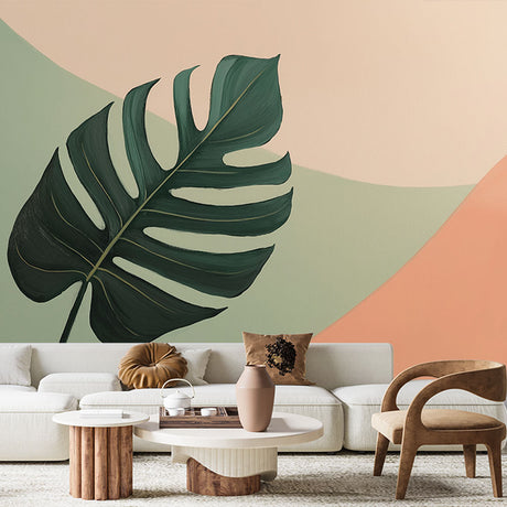 Modern Monstera leaf wallpaper creating a calm atmosphere in a bright living room with minimalist furniture