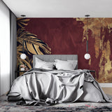 Monstera leaf pattern adding luxury to home office with burgundy and gold color scheme