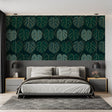 Monstera leaf wallpaper in modern living room showing green and gold pattern catching natural light
