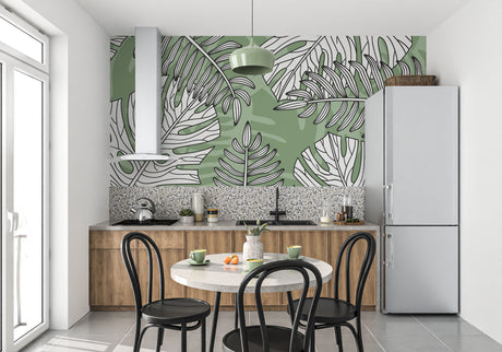 Modern living room with Monstera leaf wallpaper creating a fresh botanical atmosphere