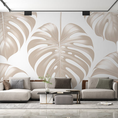 Monstera leaf wallpaper creating an elegant atmosphere in a modern living room with natural light highlighting the beige pattern