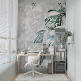 Home office featuring elegant Monstera leaf wallpaper with marble effect backdrop