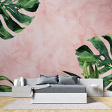 Bedroom featuring botanical Monstera wallpaper with soft pink background