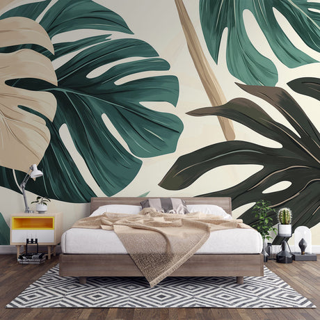 Modern living room with Monstera leaf wallpaper mural creating a stunning tropical accent wall behind grey sofa