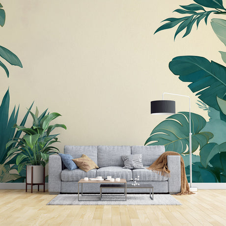 Modern living room featuring Monstera leaf wallpaper with emerald green leaves on beige, creating a fresh tropical atmosphere
