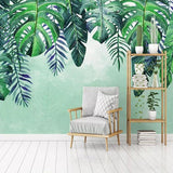 Tropical monstera wallpaper brightening up a home office with natural light