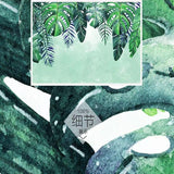 Green monstera wall mural making a bedroom feel like a peaceful retreat