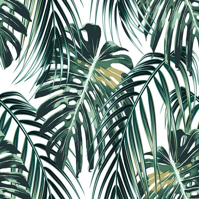Botanical wallpaper featuring monstera leaves in stylish home office space