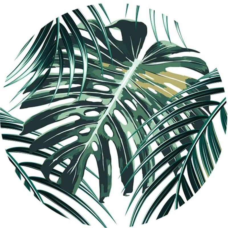 Green monstera leaf pattern mural in modern dining room setting