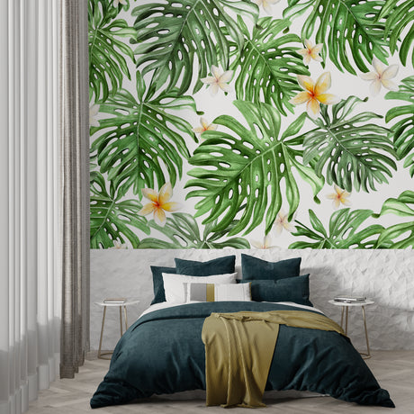 Monstera leaf wallpaper creating a fresh atmosphere in a modern living room with natural light