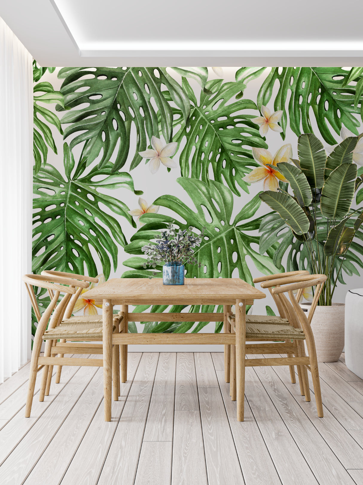 Tropical monstera wallpaper in a bright bedroom setting with white furniture