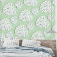 Modern living room featuring Monstera leaf wallpaper in white and mint green, creating a fresh botanical atmosphere