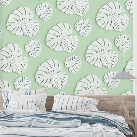 Modern living room featuring Monstera leaf wallpaper in white and mint green, creating a fresh botanical atmosphere