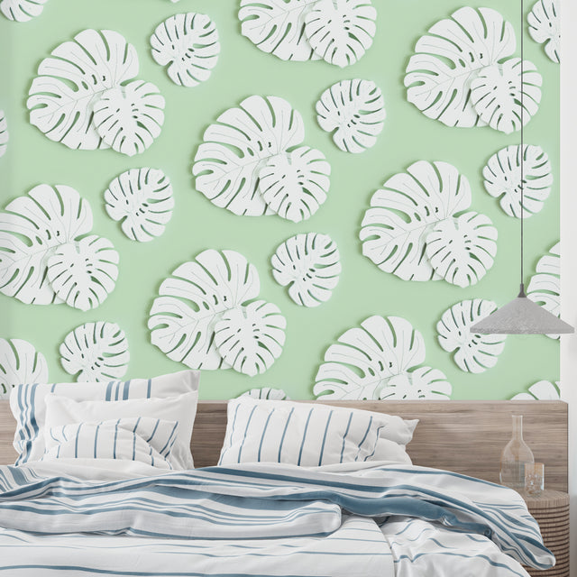 Modern living room featuring Monstera leaf wallpaper in white and mint green, creating a fresh botanical atmosphere