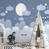 Celestial wallpaper in a reading nook showing the full moon and cloud details
