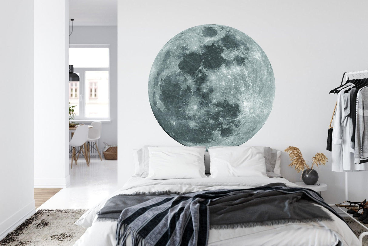 Celestial moon mural in minimalist living room adds depth and character