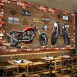 Motorcycle garage wallpaper mural displayed in modern industrial man cave with leather sofa and ambient lighting