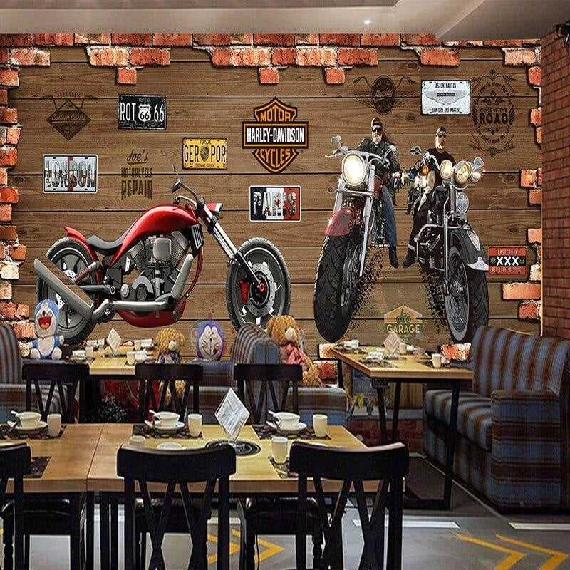 Vintage motorcycle wall mural creating focal point in urban style restaurant with exposed brick walls