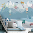 Mountain Adventure Wallpaper in bright nursery with white furniture showing floating hot air balloons
