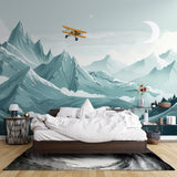 Kids playroom featuring mountain landscape mural with airplane, creating depth and adventure feel