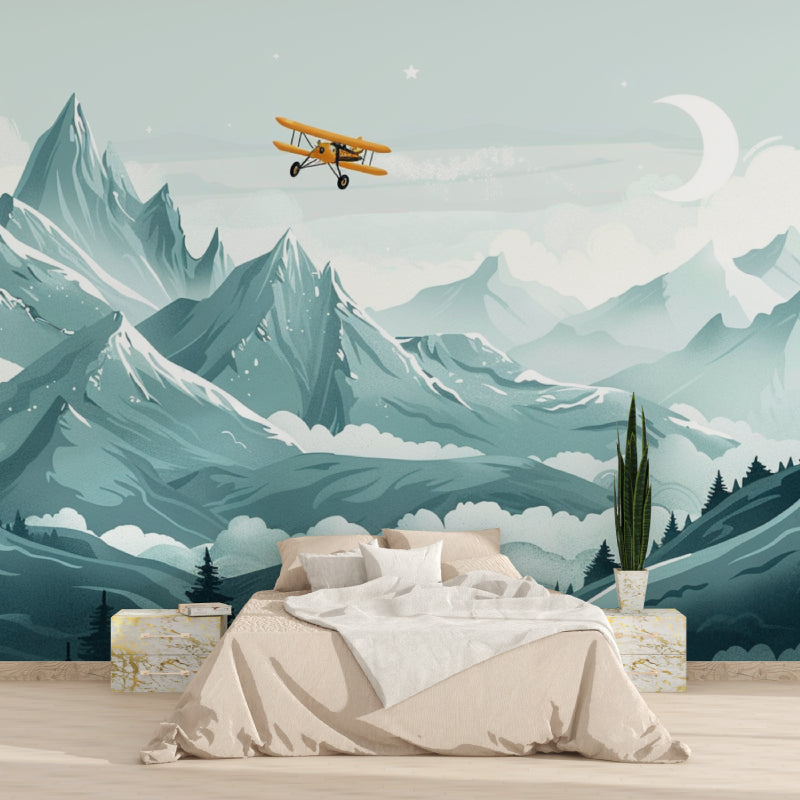 Home office with mountain scene wallpaper showing aerial view of snowy peaks and vintage plane