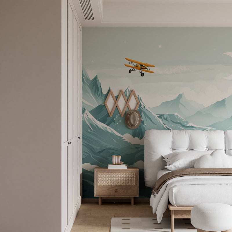 Living room decorated with panoramic mountain wallpaper featuring golden airplane and misty peaks