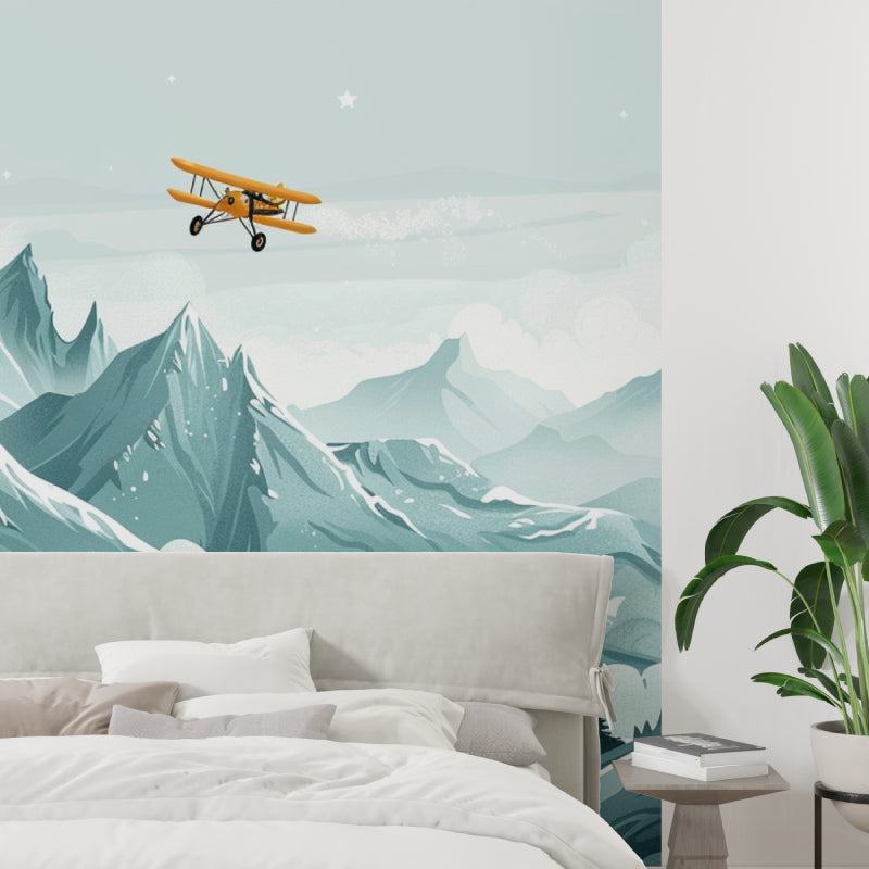 Reading nook with adventure themed wallpaper showing mountain landscape and flying airplane