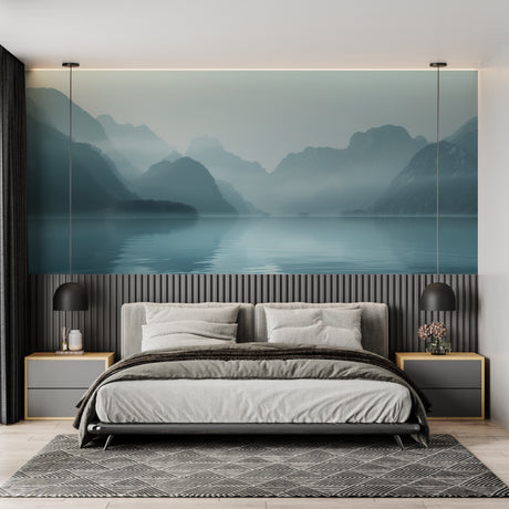 Mountain lake wallpaper creating depth in modern living room with grey sofa