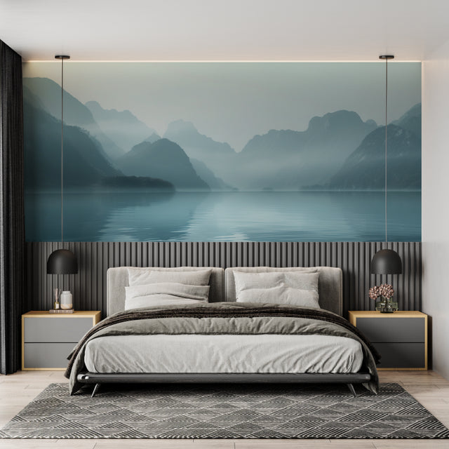 Mountain lake wallpaper creating depth in modern living room with grey sofa