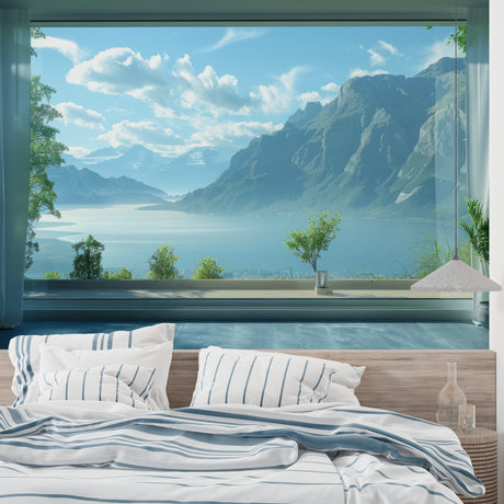 Mountain lake wallpaper creating depth in modern living room with grey sofa and natural light