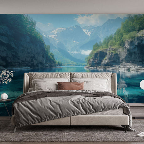 Mountain lake wallpaper mural displayed in modern living room, showing turquoise waters and snow-capped peaks