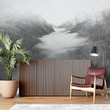 Black and white mountain mural in minimalist bedroom with wooden furniture
