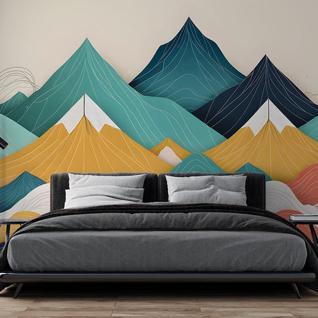Mountain mural wallpaper with geometric peaks in a modern living room setting, showcasing teal and coral tones