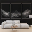 Modern mountain line art wallpaper creating depth in a minimalist living room with clean furniture and natural light