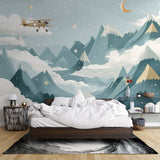 Night sky mountain mural in modern nursery with airplane theme