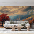 Mountain landscape wallpaper with red maple tree shown in a modern living room, creating a dramatic autumn accent wall