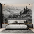 Mountain mural wallpaper creating depth in a modern living room, black and white alpine peaks above grey sofa