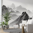 Mountain peak wallpaper creating drama in a minimalist living room, black and white design adding depth to modern interior