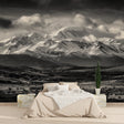 Mountain landscape wallpaper creating depth in a minimal living room setting
