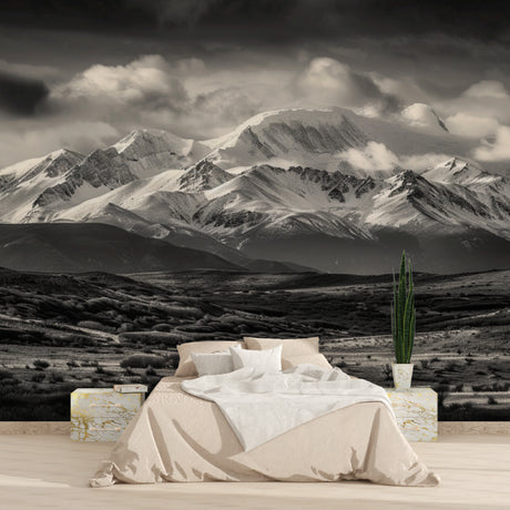 Mountain landscape wallpaper creating depth in a minimal living room setting