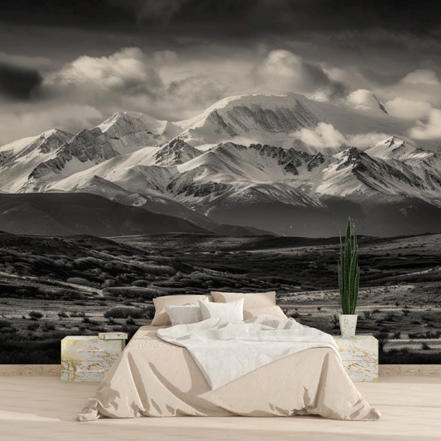 Mountain landscape wallpaper creating depth in a minimal living room setting
