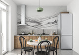 Black and white mountain wallpaper adding drama to a master bedroom with soft lighting