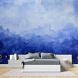 Mountain range wallpaper with gold accents creating depth in modern living room
