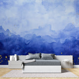 Mountain range wallpaper with gold accents creating depth in modern living room