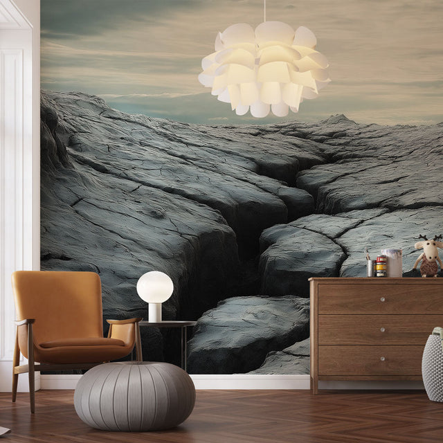 Mountain landscape wallpaper creating depth in a modern living room with grey sofa and natural lighting