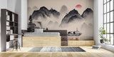 Mountain scene wallpaper with red sun accent in an entrance hall
