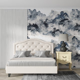 Oriental mountain mural in master bedroom with simple furniture and bamboo accents